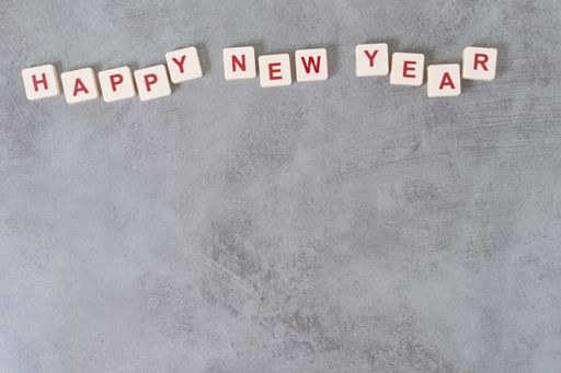 A top view of gray background with "Happy new year" text