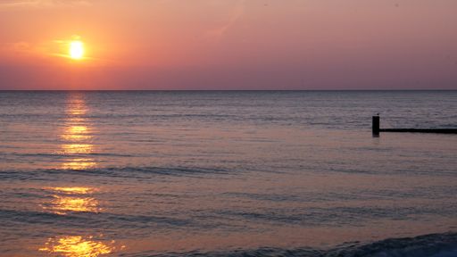 The Sunrise over Lake Michigan seen from Kenilworth Beach in Illinois