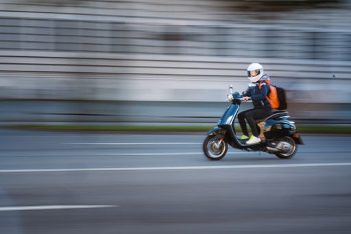 Motion blur image of the motorcyclist in downtown Munich, Germany