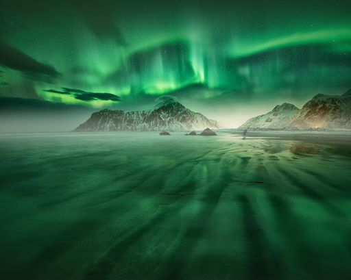 A beautiful view of the aurora borealis reflection on the lake in Lofoten, Norway
