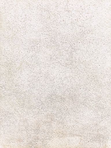 A closeup shot of a rough gray textured grunge concrete wall