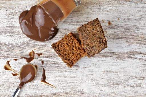 A closeup of pieces of chocolate cake with chocolate cream. Top view.