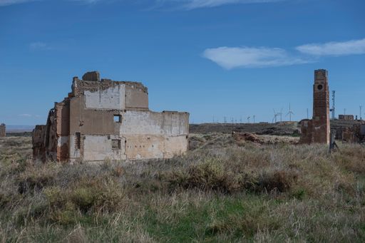 An old shattered building against a cloudy sky in the city of Belchite in Spain