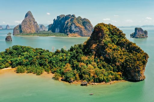 A beautiful view of nature with a calm, blue sea and islands in Thailand