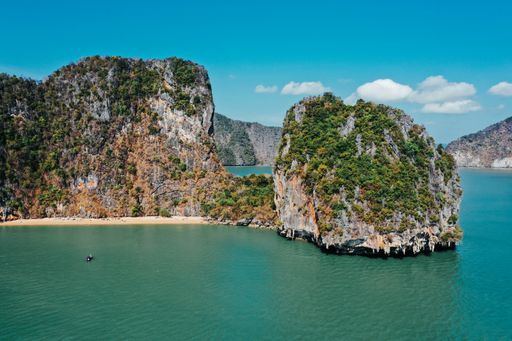 A beautiful view of nature with a calm, blue sea and islands in Thailand