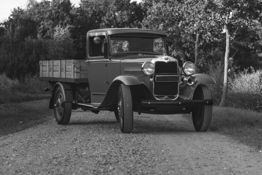 A greyscale shot of a classic T Ford pickup truck in the Netherlands