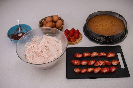 process of making a strawberry tart in a white kitchen all ingredients