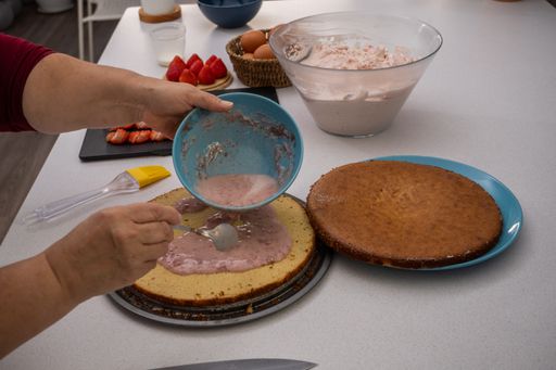 process of making a strawberry tart in a white kitchen all ingredients