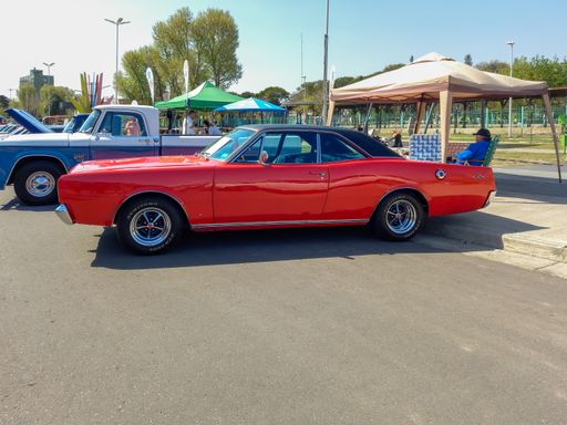 Dodge GTX Slant Six Power 1970 classic 2 door red coupe. Sporty muscle car manufactured by Chrysler Argentina in San Justo. Side view. Copyspace