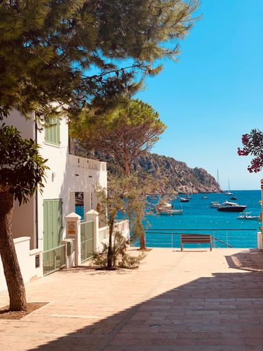 A villa with a scenic waterfront at a bay during summer