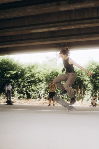 A teenager is skateboarding in skatepark under the bridge in Sarajevo, Bosnia and Herzegovina