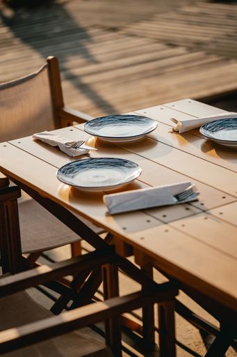 A vertical shot of a table for three people