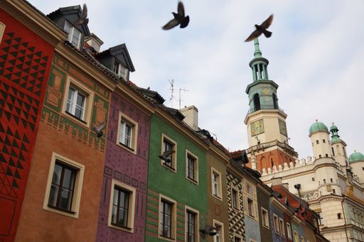 Poznan, Poland, a low angle shot of the city hall and the colored houses of the old market