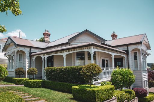 View of white wooden colonial villa in Remuera. Vintage look. Auckland, New Zealand - December 4 2019