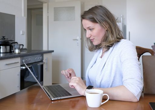 A beautiful shot of a woman browsing on her laptop