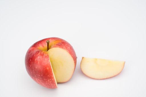 isolated fresh and tasty bio organic apple slice on white background with copy space