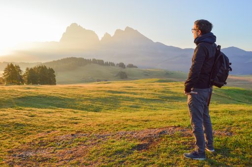 A hiker in Alpe di Siusi, Seiser Alm, Dolomitas, Italy