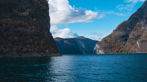 A beautiful view of river surrounded by mountains in Gudvangen, Norway