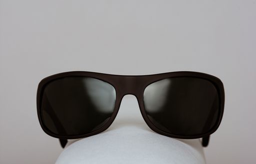 A closeup shot of a sunglasses isolated on a grey background