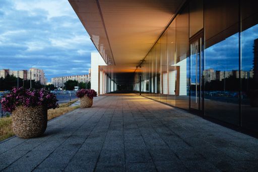 The empty building patio in front of the glass windows