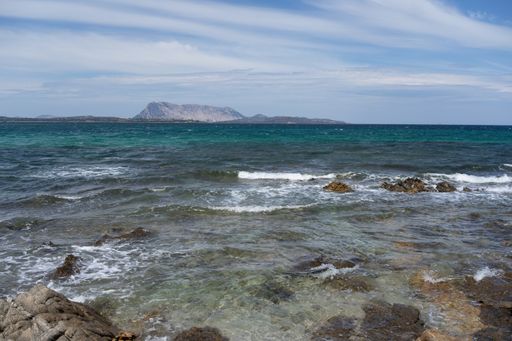 A beautiful panoramic view of a blue crystal sea from the shore