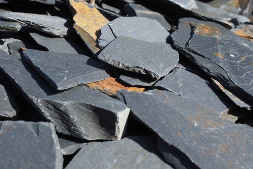 Close up of broken grey slate in quarry in Wales