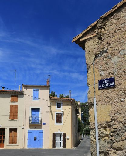 A closeup of colorful buildings in a quiet street town in France