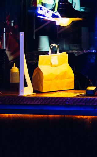 A takeaway box at a restaurant table