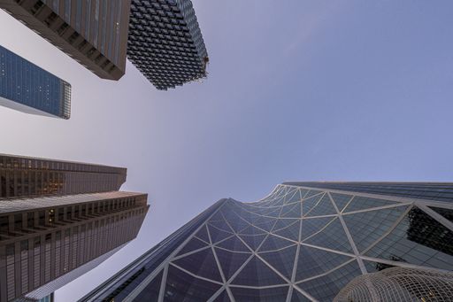 A low angle shot of The Bow and Telus Sky towers captured in Calgary, Alberta, Canada