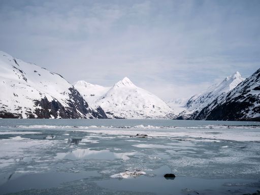The white cloudy sky over the glacier mountain range in winter