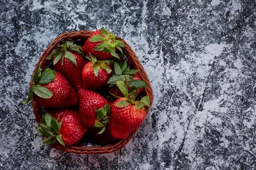 A top view strawberry basket on gray background