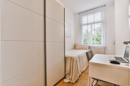 A beautiful image of a fully decorated single bedroom in a white interior design house; design ideas