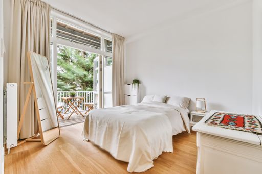 A beautiful image of a fully decorated double bedroom in a white interior design house; design ideas