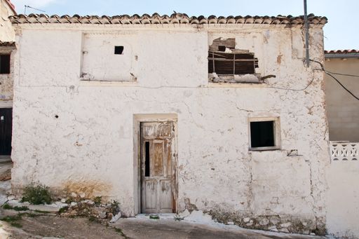 A view of the old white abandoned house in Spain