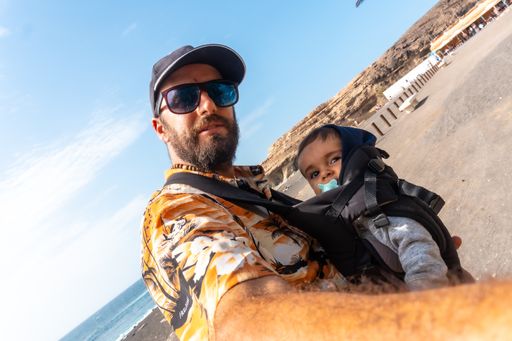A selfie of a father with his on the beach of Ajuy, Pajara, west coast of the island Fuerteventura, Canary Islands, Spain