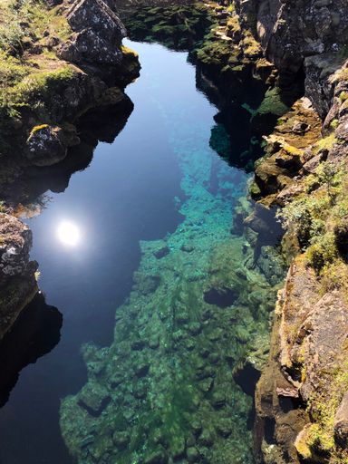 A vertical shot of clear water at Thingvellir, Iceland, on a sunny day