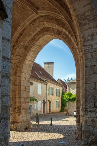 A vertical shot of the Saint Maur church in Martel, Lot, France during d