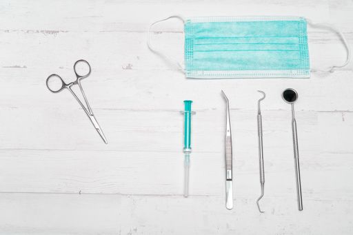 A top view of a mask and medical instruments on the table