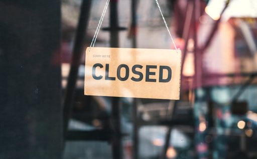 A sign that says "Sorry, we're closed". Shops in Munich and throughout Germany and Europe close due to financial difficulties and economic crisis.