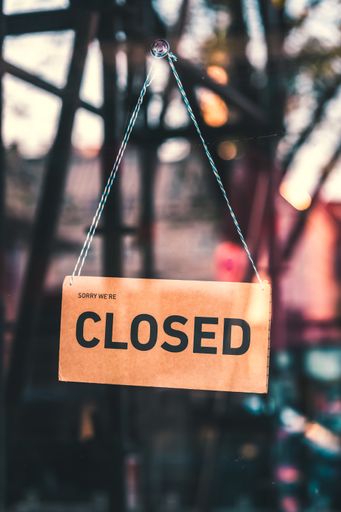 A sign that says "Sorry, we're closed". Shops in Munich and throughout Germany and Europe close due to financial difficulties and economic crisis.