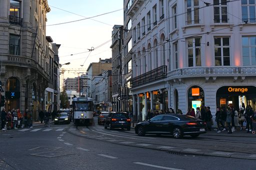 A beautiful view of a tram and cars in the city of Antwerp, Belgium