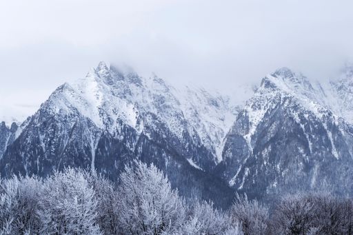 Coltii Morarului peak and Bucsoiu peek seen from Grecului peak. Winter landscape between Azuga and Grecul peak. Romania.