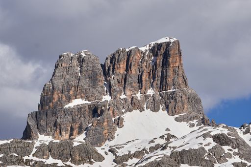 The mountain with rocky surface on a sunny day with the sky in the background