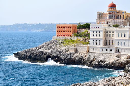 Scenic coastal view of Santa Cesarea Terme, a charming seaside town in Salento, Italy, known for its historic architecture and sea views.