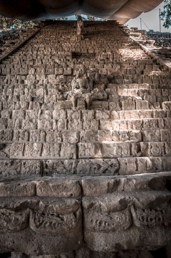 Several statues on the stairs of the Mayan Ruins in Honduras