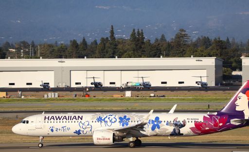 The Hawaiian Airlines Airbus A321 neo in Stitch livery rolling down the runway. San Jose.