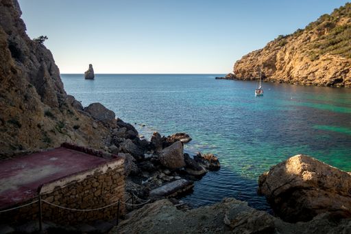 The rocks and cliffs on the beach during daytime