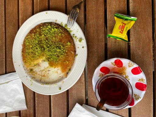 A top view of Turkish desert Kunefe, Turkish Delight and Turkish tea at Harringay, London, UK