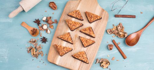 Nut corner, traditional german sweets called Nussecke, covered with chocolate, christmas bakery