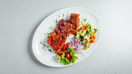 An overhead shot of a delicious meal with meat and salad
